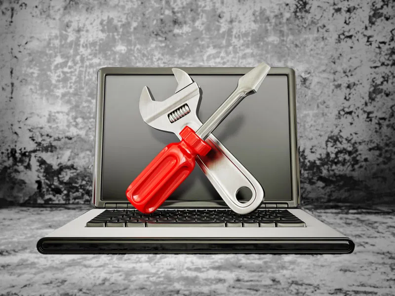 Laptop-with-wrench-and-screwdriver-tech-support