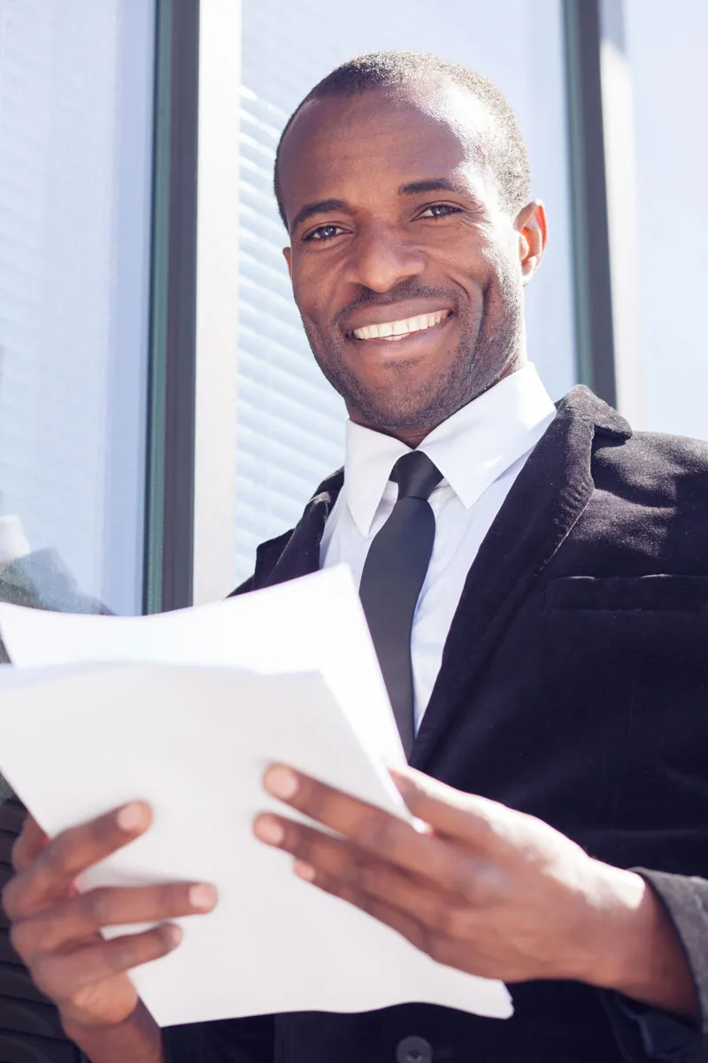 Man-with-smile-looking-at-camera-in-business-attire